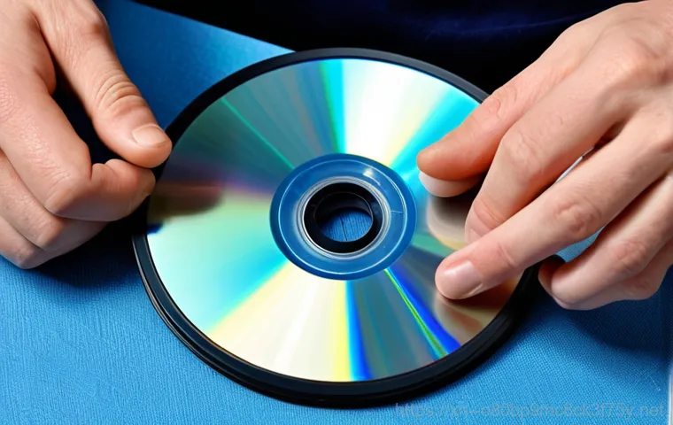 호수동 CDFS_FILE_SYSTEM - **Prompt:** A computer screen displaying the Windows Device Manager, CD-ROM drive highlighted, surro...