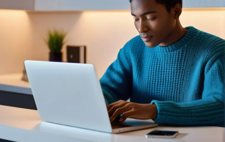 하면 UNMOUNTABLE_BOOT_VOLUME - A person (wearing a casual t-shirt and jeans) intently focused on a laptop screen, which displays a ...