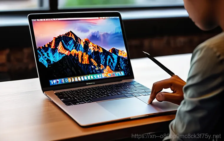 고등동 부트캠프설치 - An overhead shot of a clean, well-organized tech workspace, focusing on a silver Apple MacBook Pro (... 고등동 부트캠프설치 - An overhead shot of a clean, well-organized tech workspace, focusing on a silver Apple MacBook Pro (...