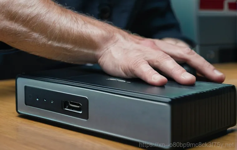 서구 STATUS_FILE_READ_FAILURE - A person in their late 20s or early 30s, dressed in casual work attire, sits at a desk in a home off...