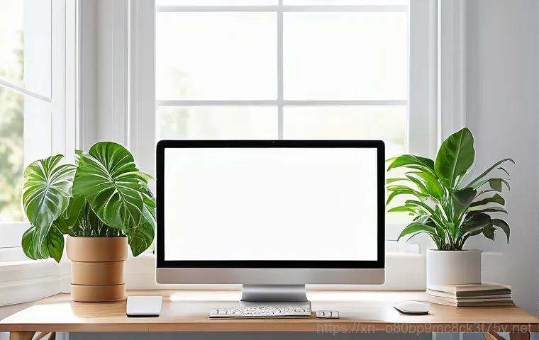 관악구 윈도우8 windows8 재설치 포맷  초기화 - A young adult, gender-neutral, sitting in a modern, clean home office. They are looking at a compute...