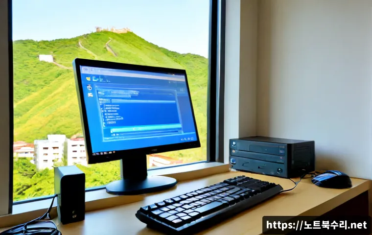 분당동 FAT_FILE_SYSTEM - Photorealistic IT support workstation in Bundang-dong, a desktop monitor showing a clean blue system...