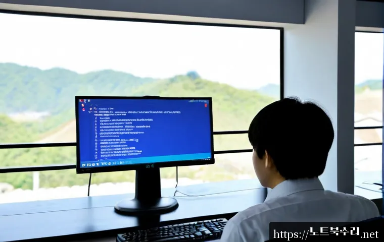 팔달구 STATUS_KERNEL_MODE_EXCEPTION - Photorealistic IT support workstation in Paldal-gu, Suwon, dual monitors showing a blank deep-blue s...