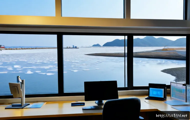 대부동 STATUS_FILE_LOCK_CONFLICT - Photorealistic coastal engineering office on Daebudo Island, focused technician at a dual-monitor wo...