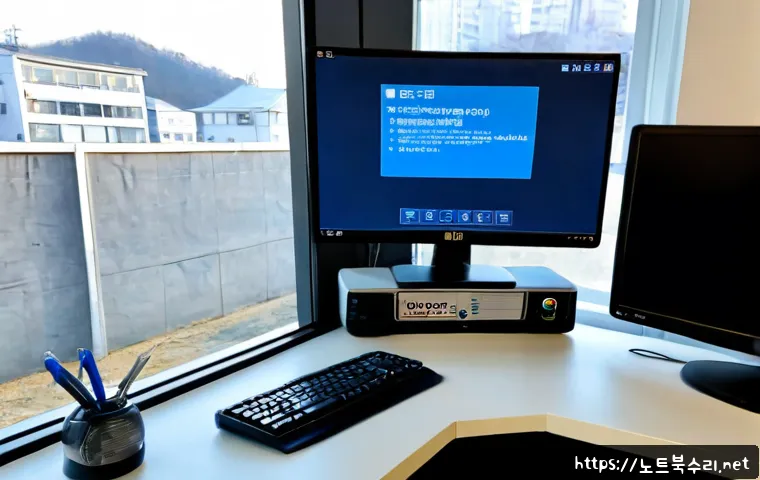 회정동 STATUS_KERNEL_THREAD_FAILURE - Photorealistic IT support workstation in a compact Korean office, dual monitors showing a blank blue...
