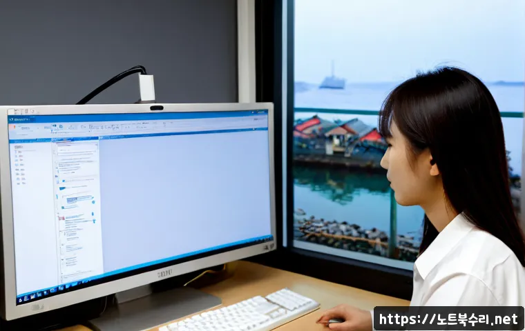선원면 자동복구 - Photorealistic IT recovery workstation in a quiet Korean coastal township office, desktop monitor sh...