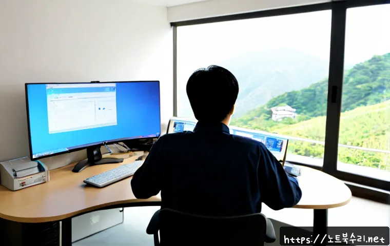 홍파동 KERNEL_DATA_INPAGE_ERROR - Photorealistic IT support workstation in a compact Hongpa-dong office, dual monitors showing a blank...